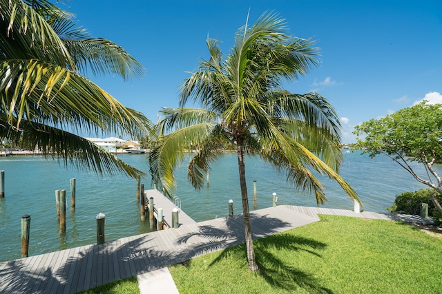 95 Coco Plum Dr Unit 1A, Marathon, FL 33050 - dock area featuring a water view and a yard