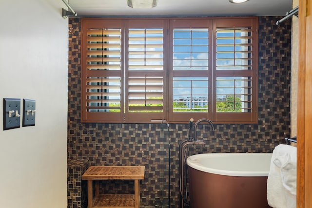 95 Coco Plum Dr Unit 1A, Marathon, FL 33050 - bathroom featuring a soaking tub and healthy amount of natural light