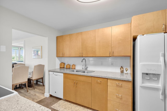 1901 S Roosevelt Blvd Unit 104N, Key West, FL 33040 - kitchen with white appliances, decorative backsplash, light countertops, and light wood finished floors