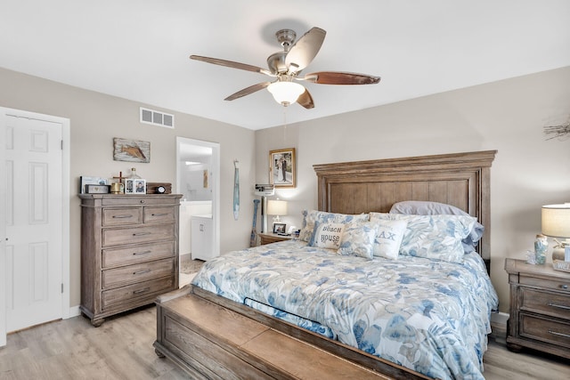1901 S Roosevelt Blvd Unit 104N, Key West, FL 33040 - bedroom featuring light wood finished floors, ceiling fan, and connected bathroom