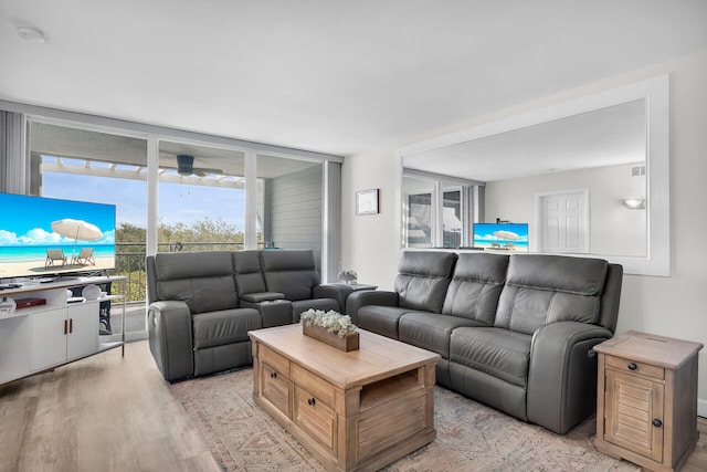 1901 S Roosevelt Blvd Unit 104N, Key West, FL 33040 - living area with light wood-type flooring and expansive windows