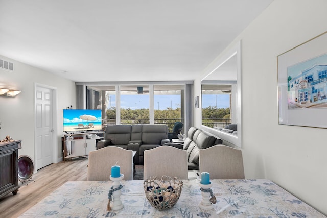 1901 S Roosevelt Blvd Unit 104N, Key West, FL 33040 - dining space featuring wood finished floors, healthy amount of natural light, and a ceiling fan