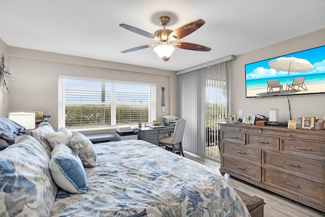 1901 S Roosevelt Blvd Unit 104N, Key West, FL 33040 - bedroom with access to exterior, light wood finished floors, and ceiling fan