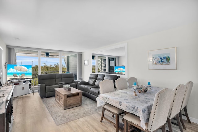 1901 S Roosevelt Blvd Unit 104N, Key West, FL 33040 - dining space featuring light wood-style floors and expansive windows