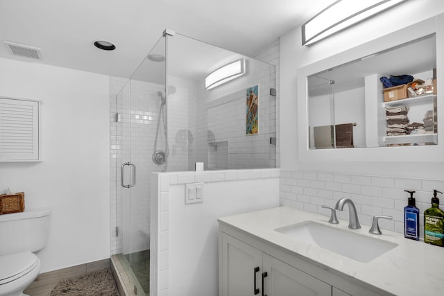 1901 S Roosevelt Blvd Unit 104N, Key West, FL 33040 - full bath featuring vanity, a shower stall, and decorative backsplash
