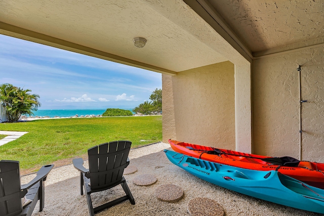 1133 W Ocean Dr Unit 4, Marathon, FL 33050 - view of patio with view of water and beach