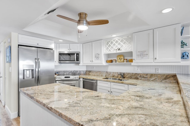 1133 W Ocean Dr Unit 4, Marathon, FL 33050 - kitchen featuring open shelves, appliances with stainless steel finishes, a sink, light stone counters, and recessed lighting