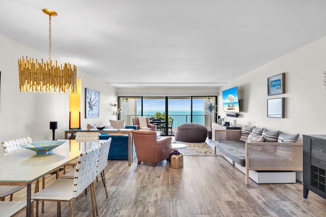 1133 W Ocean Dr Unit 4, Marathon, FL 33050 - dining space featuring a chandelier and wood finished floors