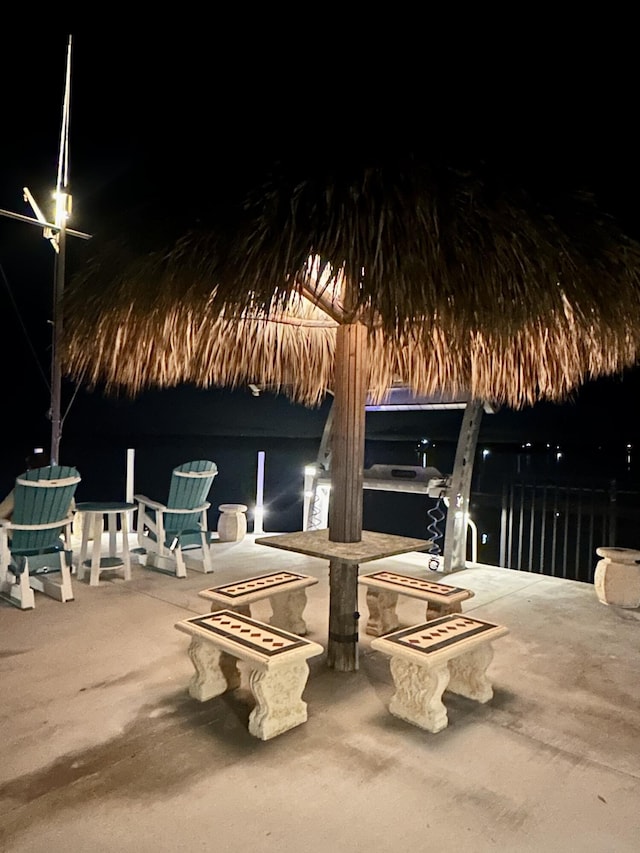 101620 Overseas Hwy Unit 11N, Key Largo, FL 33037 - patio at twilight featuring a patio and a water view