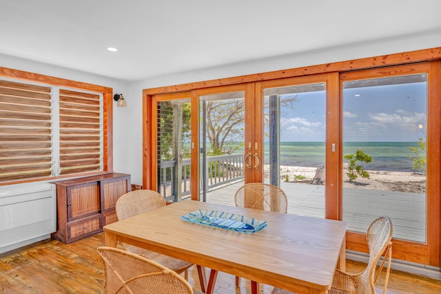 10 W Cook, Big Pine, FL 33043 - dining space featuring a water view, baseboard heating, recessed lighting, and light wood-style flooring