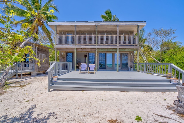 10 W Cook, Big Pine, FL 33043 - rear view of house featuring a wooden deck and a balcony
