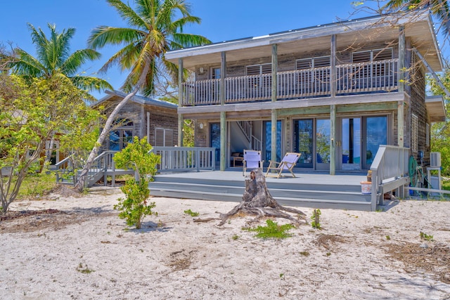 10 W Cook, Big Pine, FL 33043 - back of house featuring french doors, a wooden deck, and a balcony