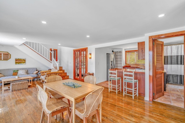 10 W Cook, Big Pine, FL 33043 - dining room featuring light wood-type flooring, recessed lighting, stairs, and baseboards