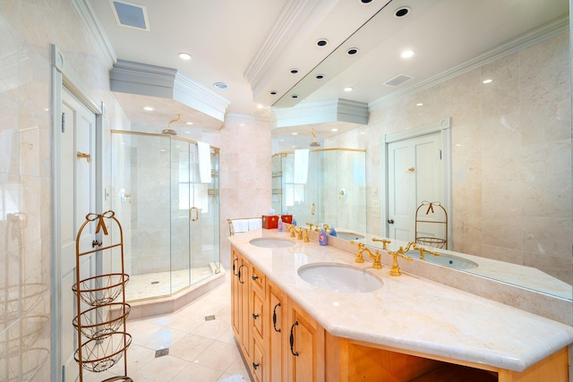 bathroom featuring crown molding, tile patterned floors, vanity, and a shower with shower door