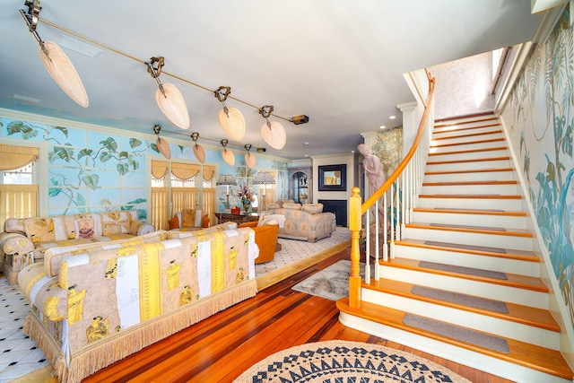 interior space with hardwood / wood-style flooring, ornamental molding, and plenty of natural light