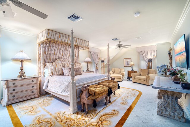 bedroom with light carpet, ornamental molding, and ceiling fan