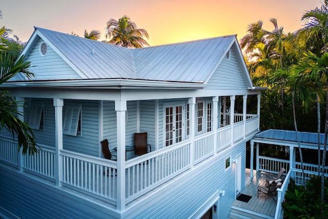 view of back house at dusk