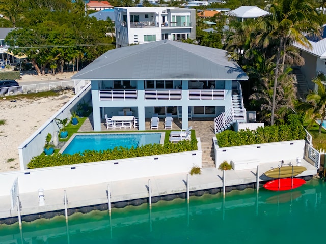 254 W Seaview Cir, Duck, FL 33050 - back of property featuring a balcony, stairs, a fenced backyard, and a patio area