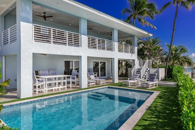 254 W Seaview Cir, Duck, FL 33050 - rear view of property featuring ceiling fan, stairway, a patio, a balcony, and stucco siding