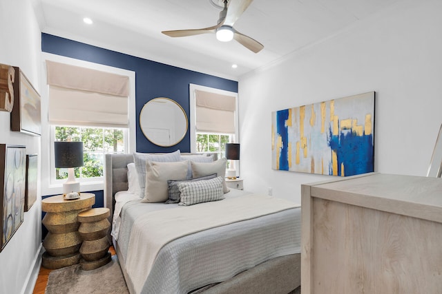 bedroom featuring a ceiling fan, ornamental molding, recessed lighting, and wood finished floors
