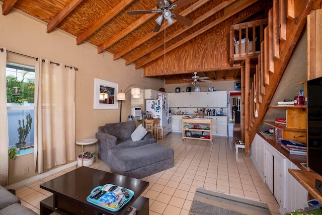 living room with light tile patterned flooring, ceiling fan, high vaulted ceiling, and beamed ceiling