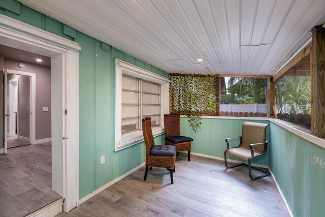 sunroom / solarium featuring wooden ceiling