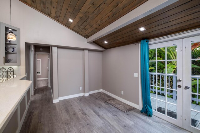 interior space with wood ceiling, wood-type flooring, and french doors