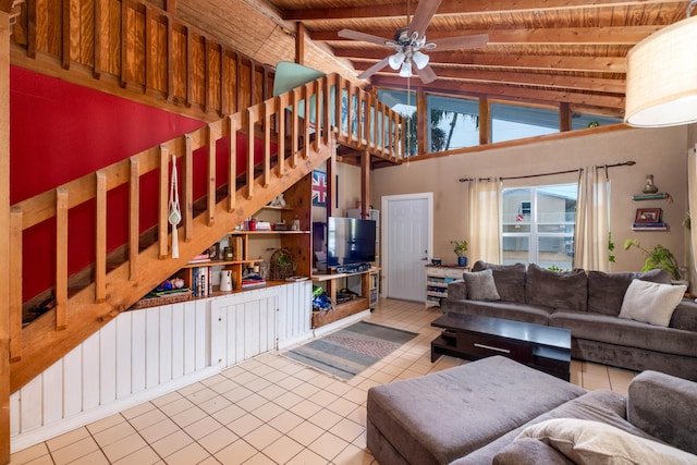 tiled living room with wood ceiling, ceiling fan, high vaulted ceiling, and beamed ceiling