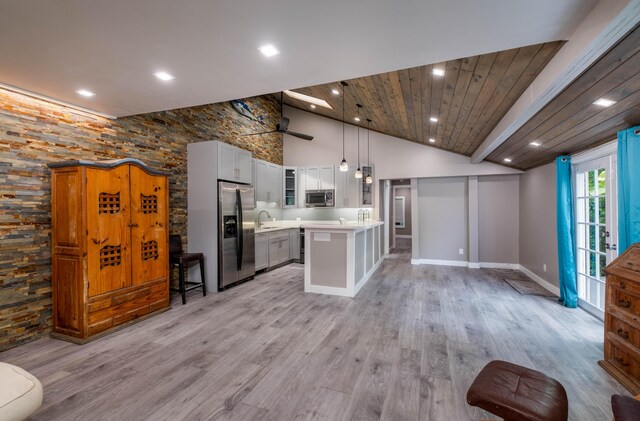 kitchen with pendant lighting, sink, wood ceiling, and light hardwood / wood-style floors