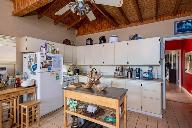 kitchen featuring white appliances, wooden ceiling, light tile patterned floors, and white cabinets