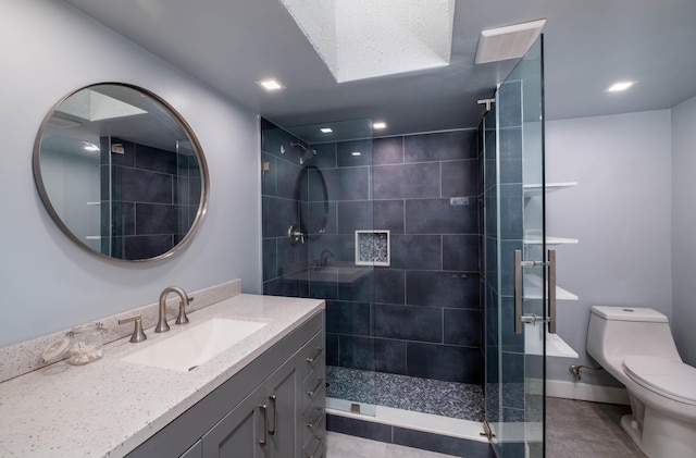 bathroom featuring vanity, toilet, and walk in shower