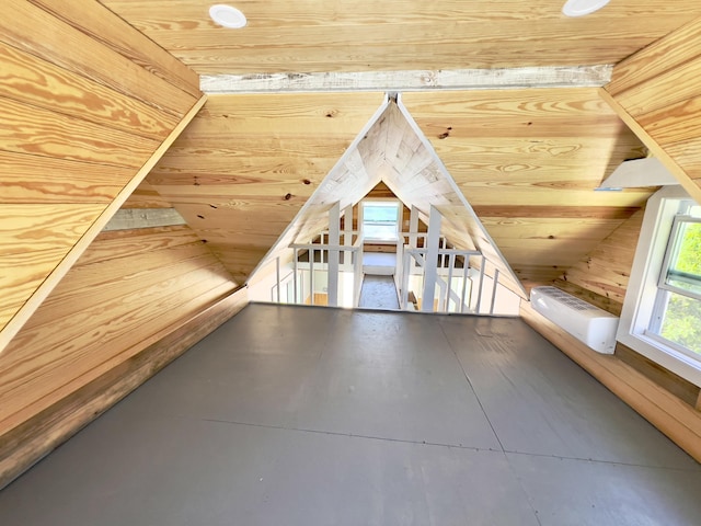 bonus room featuring vaulted ceiling, a wall unit AC, wooden ceiling, and wood walls