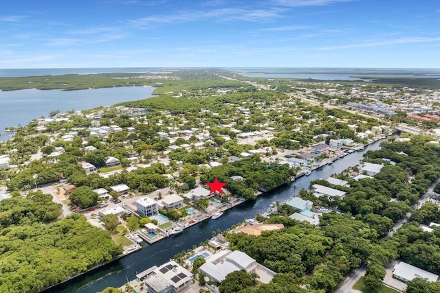 birds eye view of property with a water view and a residential view