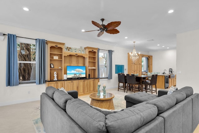 living room featuring a wealth of natural light, baseboards, crown molding, and recessed lighting