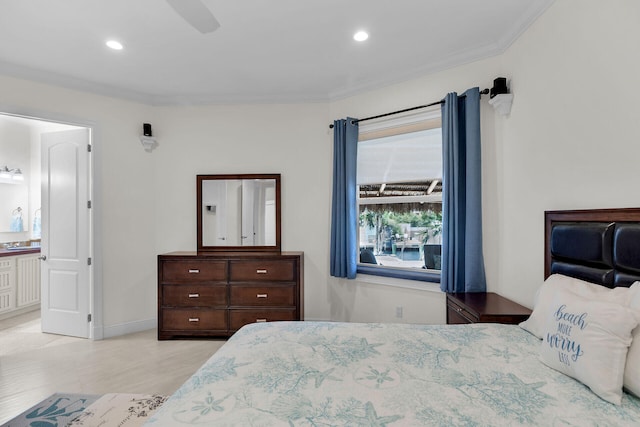 bedroom featuring baseboards, ornamental molding, connected bathroom, and recessed lighting