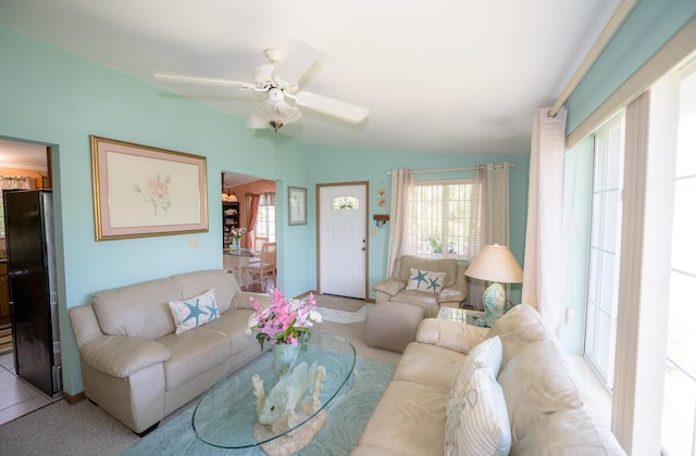 living room with light carpet and ceiling fan