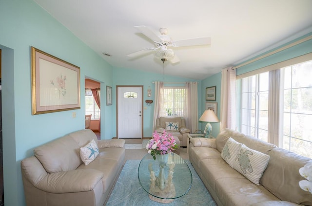 living room featuring ceiling fan and vaulted ceiling