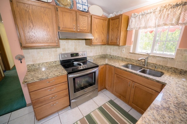 kitchen with tasteful backsplash, sink, stainless steel electric stove, and light stone countertops