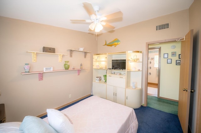 bedroom featuring ceiling fan and carpet