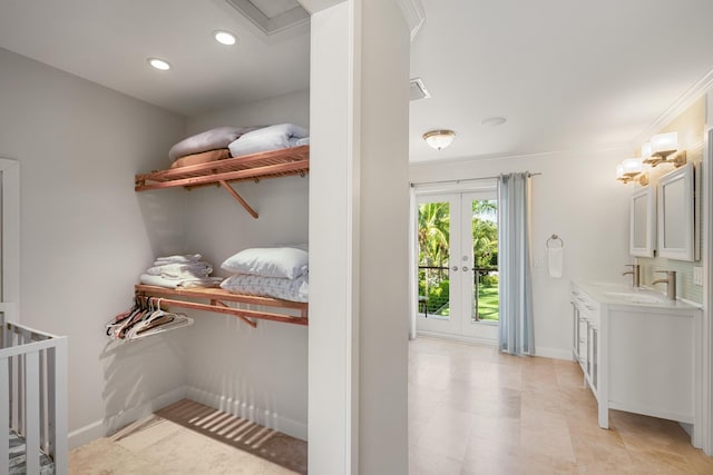 interior space with french doors and sink