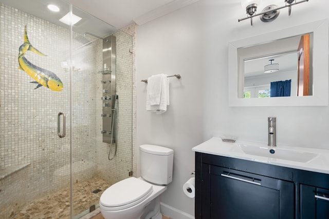 bathroom featuring vanity, toilet, and a shower with door