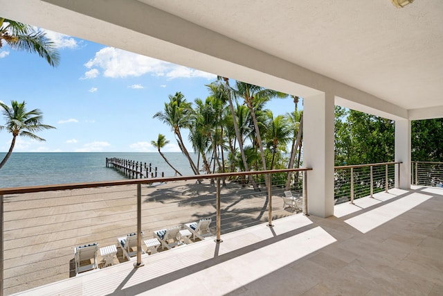 balcony featuring a water view