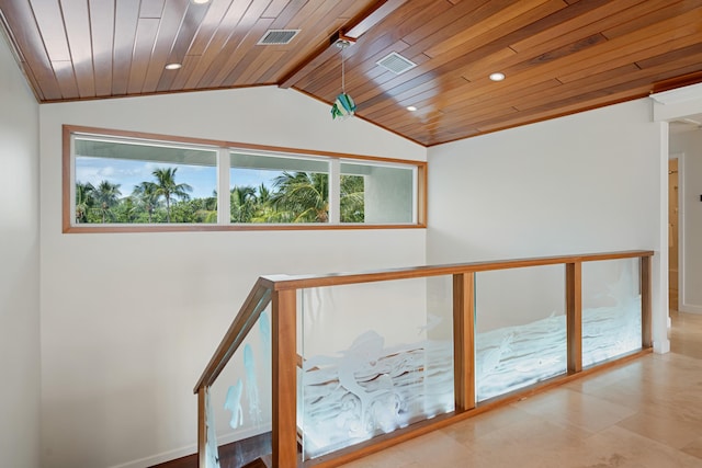 hall with lofted ceiling and wooden ceiling