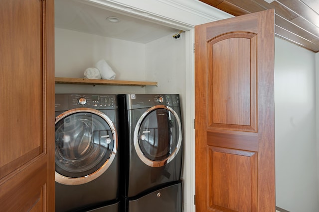 laundry area with separate washer and dryer