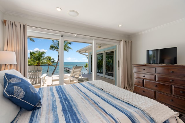 bedroom with ornamental molding and access to exterior