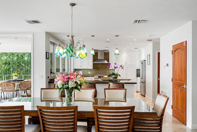 dining area featuring a notable chandelier