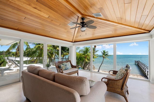 sunroom featuring wood ceiling, vaulted ceiling, ceiling fan, and a water view