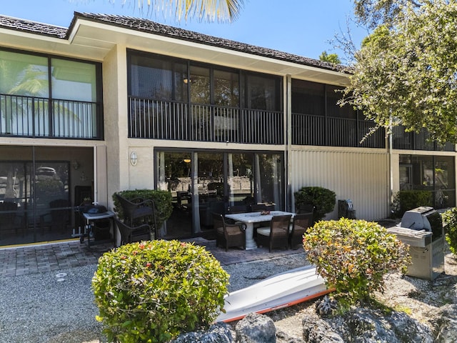 back of property featuring a patio