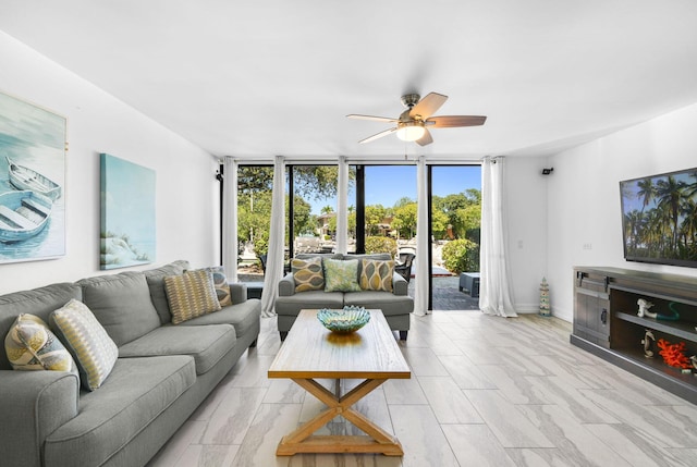 living room with floor to ceiling windows and ceiling fan