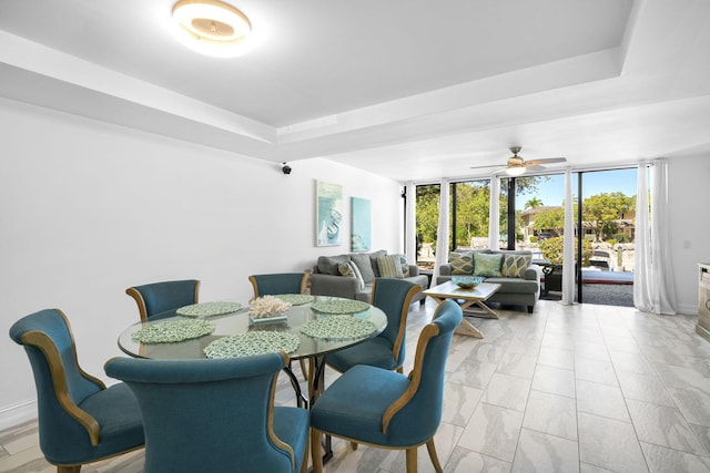 dining room featuring floor to ceiling windows and ceiling fan